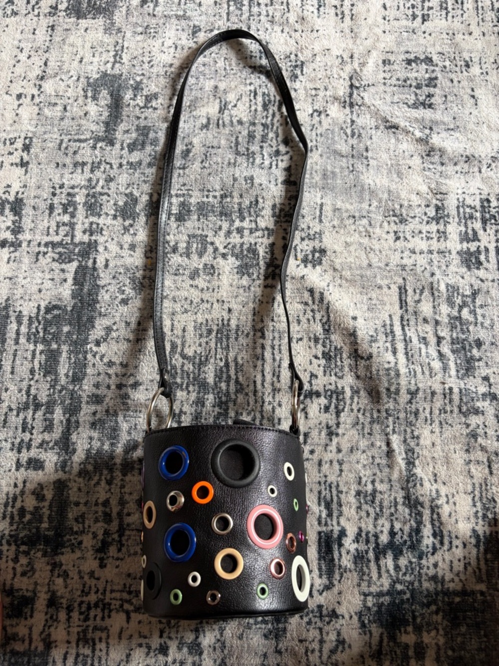 Black Leather Bucket Bag with Colorful Grommet Details